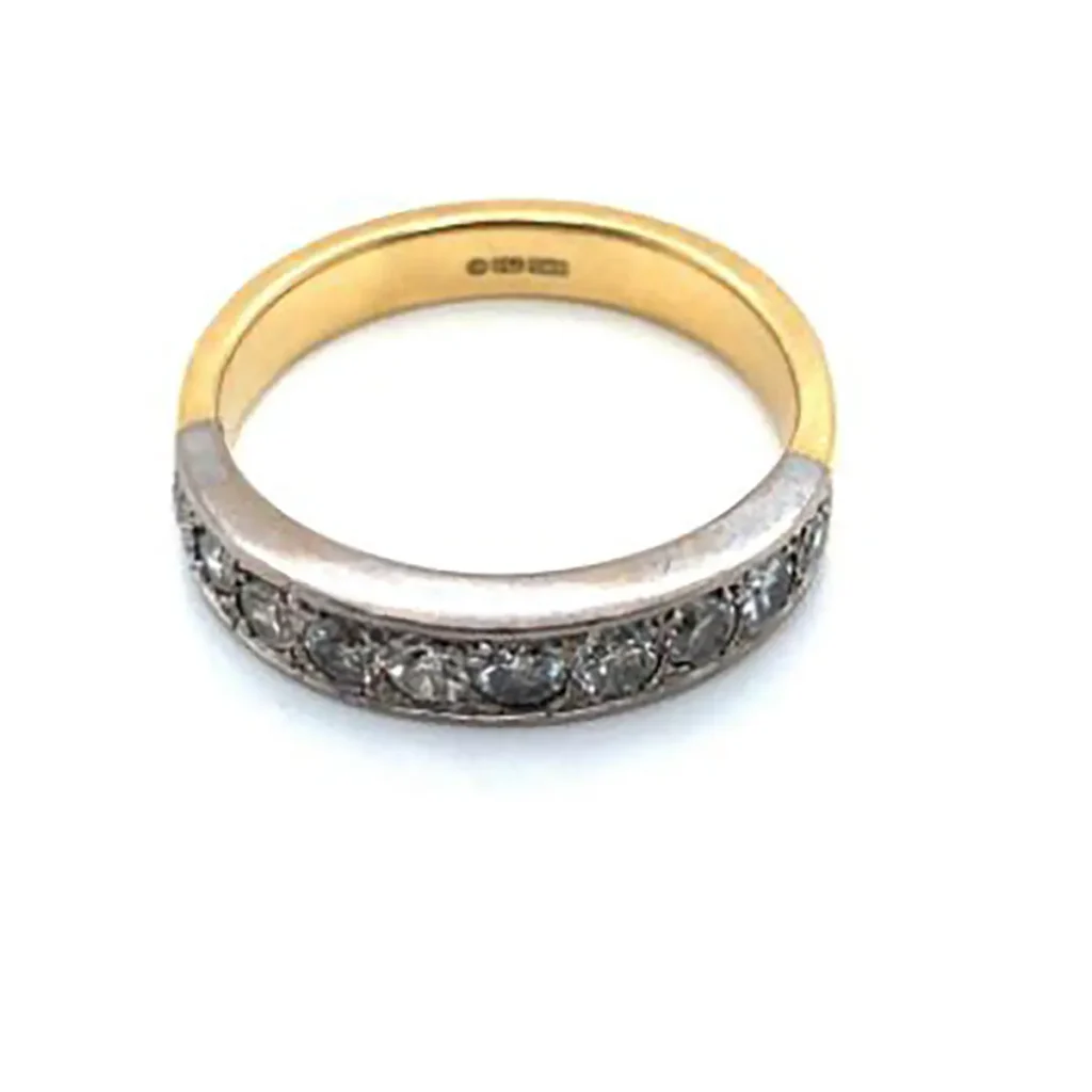 A vintage 18ct hallmarked gold diamond half-eternity ring.