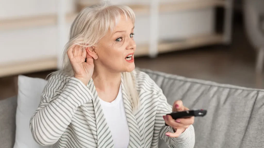 Woman struggling to hear resized